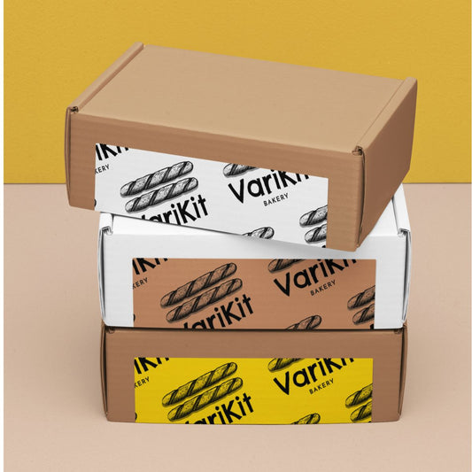 Stacked cardboard boxes sealed with custom logo thermal labels, offering a budget-friendly alternative to custom packing tape.